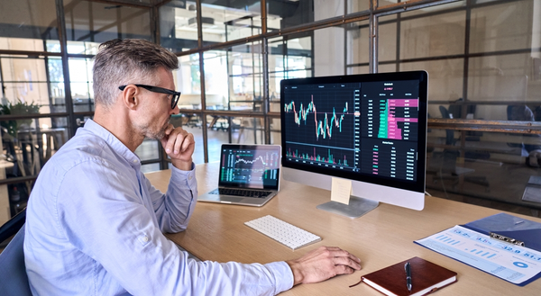 A man working at his executive desks for in a modern corporate office